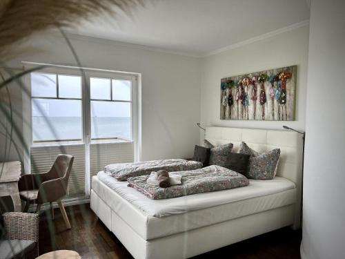 Ferienhaus-Sliminde-by-Seeblick-Ferien-direkte-Wasserlage-E-Ladesaeule-Sauna in Olpenitz