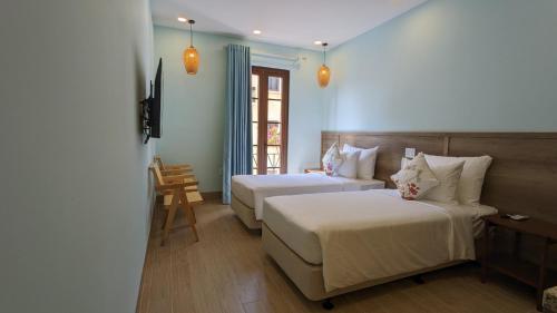 Twin Room with City View room in Aurora Phu Quoc Hotel Cafe & 3D Golf