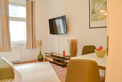 MILPAU Essen 1 - Modernes und zentrales Studio-Apartment mit Queensize-Bett - Netflix, Nespresso, Smart-TV und Terrasse