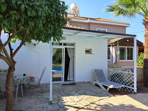 Mediterranean poolside garden cottage