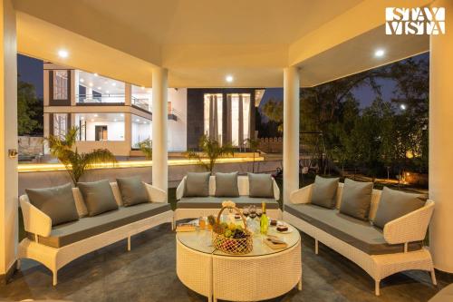 StayVista's Avadh Vatika - Mountain-View Villa with Outdoor Pool, Lawn featuring a Gazebo & Bar