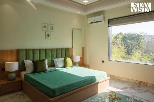 StayVista's Avadh Vatika - Mountain-View Villa with Outdoor Pool, Lawn featuring a Gazebo & Bar