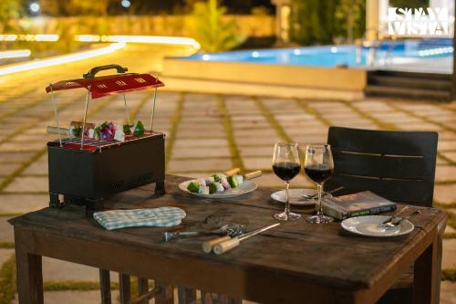 StayVista's Avadh Vatika - Mountain-View Villa with Outdoor Pool, Lawn featuring a Gazebo & Bar