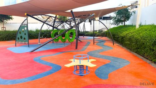 Playground, Exquisite 4BR Townhouse at DAMAC Hills 2, Dubailand by Deluxe Holiday Homes in Damac Hills 2