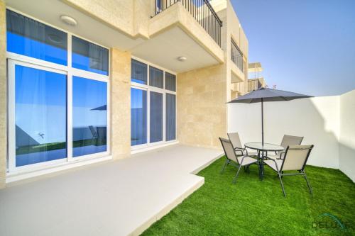 Exterior view, Exquisite 4BR Townhouse at DAMAC Hills 2, Dubailand by Deluxe Holiday Homes in Damac Hills 2