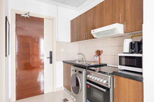 Kitchen, Silkhaus Vacation Homes Luxury Studio in Residential Neighborhood in Dubai Silicon Oasis