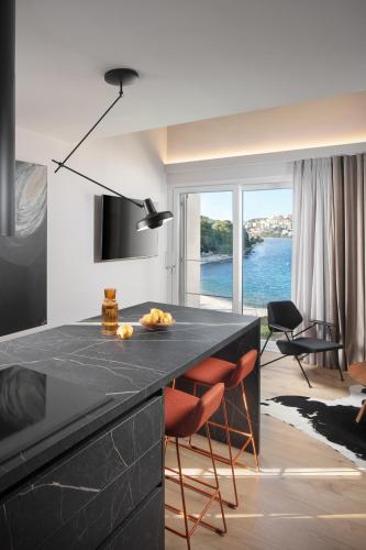 Modern Seafront Villa Steps from the Beach - Tap to explore photos