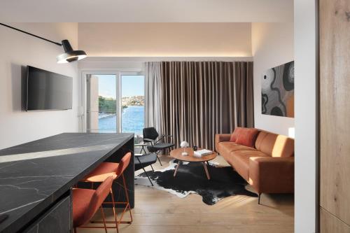 Modern Seafront Villa Steps from the Beach - Tap to explore photos