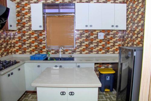 Kitchen, Delkiks Four-Bedroom Haven. in Ifako-Ijaiye