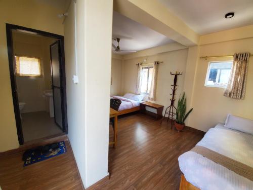 Triple Room with Private Bathroom room in Santoshi Guest House and Yoga Center