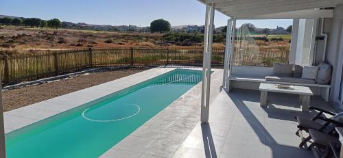 HIDDEN GEM A unique Golf Estate, Game Reserve north facing 6 sleeper 3 en suite bedrooms with 12m So in Langebaan Country Estate