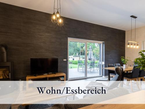 Familienfreundliche Ferienwohnung mit großem Garten, Spielplatz, privatem Badefass & Sauna 2