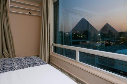 Turquoise Pyramids & Grand Egyptian museum view Hotel