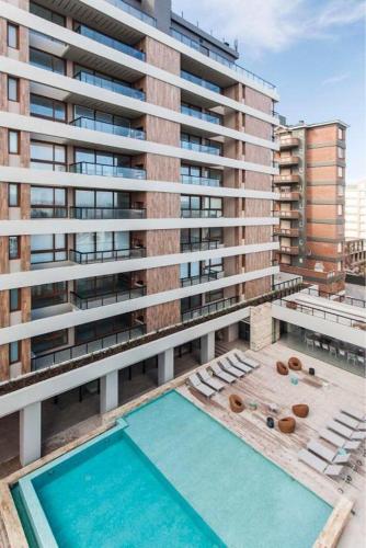 One-Bedroom Apartment room in BTWINS Pinamar Dpto Top 8vo al mar c balcon c parrilla c cochera Pileta cubierta descubierta sauna gym cine