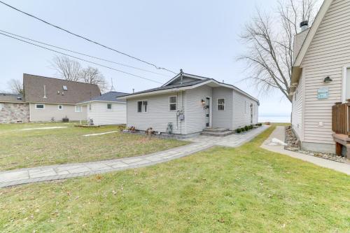 Bright Houghton Lake Home with Boat Dock and Fire Pit