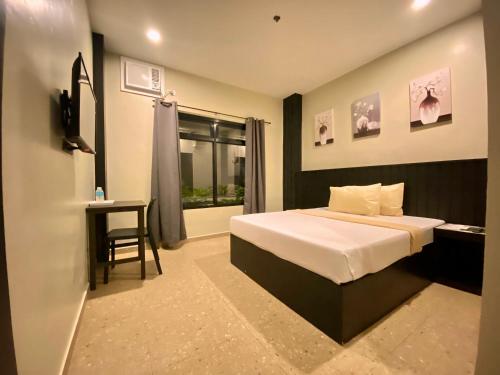 Rudolfo Suites in โรซาสซิตี้ (คาปิส)