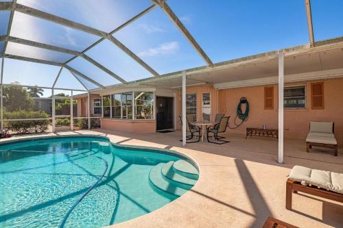 Coral Breeze! Beautiful waterfront pool home with spa! minutes from the beach