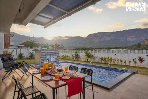 Swimming pool, StayVista's Kaarma Villa - Valley-View Villa with Outdoor Pool, Lawn featuring a Gazebo & Machan near Karla Caves