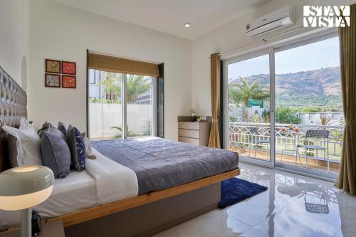 StayVista's Kaarma Villa - Valley-View Villa with Outdoor Pool, Lawn featuring a Gazebo & Machan near Karla Caves
