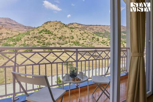Balcony/terrace, StayVista's Kaarma Villa - Valley-View Villa with Outdoor Pool, Lawn featuring a Gazebo & Machan near Karla Caves