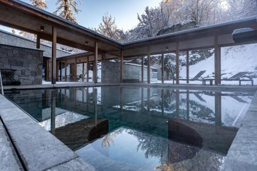 Luxus-Mountain Suite mit privatem Pool, Sauna & Dampfbad Flims