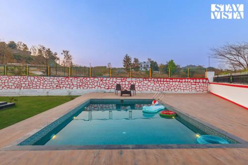 StayVista's Rustique Radiance - Hillside Retreat with Outdoor Pool & South Indian Architecture