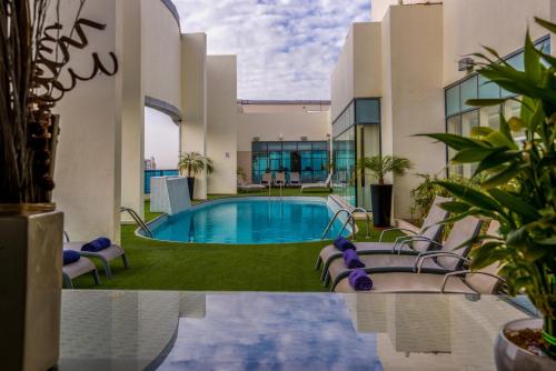 Swimming pool, First Central Hotel Suites near American School of Dubai