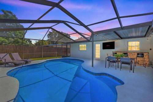 Backyard Oasis! 2 mi to Pier with Pool, Patio Bar & Putting Green