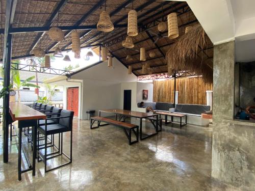 Shared lounge/TV area, Wild Monkeys Hostel in Moalboal