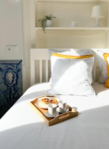 Cozy room with shared bathroom on Rua Augusta chambre d'hôte Square of the Fig Tree