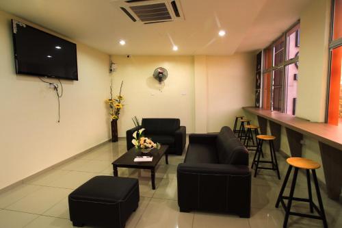 Delt lounge/TV-område, Max Inn Hotel in Parit Raja