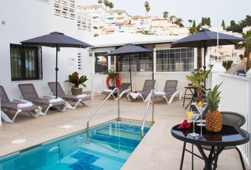 Boutique Rooms Playa Burriana - Tap to explore photos