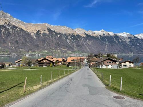 Romantic Swiss Alp Iseltwald with Lake & Mountains