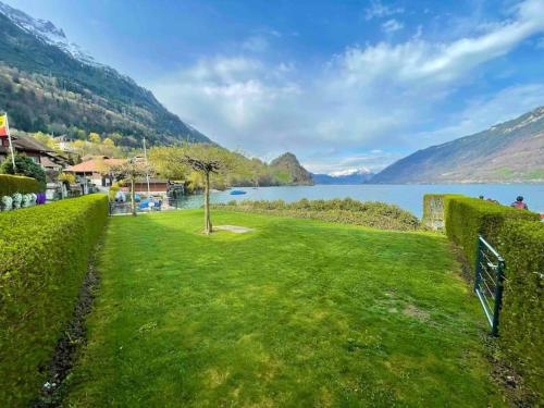 Romantic Swiss Alp Iseltwald with Lake & Mountains