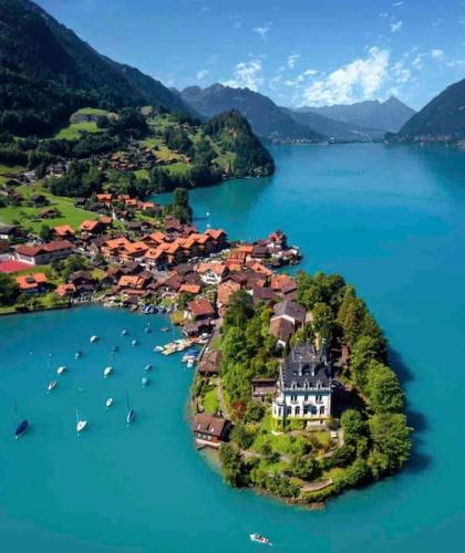 Romantic Swiss Alp Iseltwald with Lake & Mountains