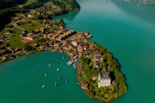 Romantic Swiss Alp Iseltwald with Lake & Mountains