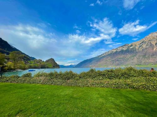 Romantic Swiss Alp Iseltwald with Lake & Mountains