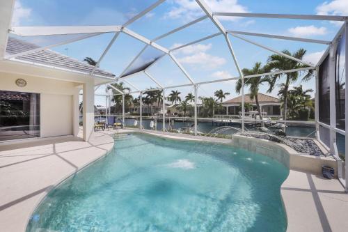 Waterfront home with pool table, heated pool and dock, Marco Island