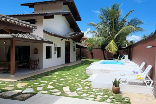 Casa a 100m da praia, com piscina, churrasqueira, área de lazer