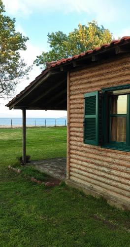 Wooden beach house / Nea Roda, Halkidiki