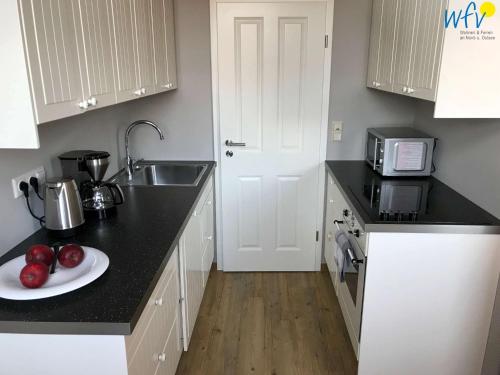 廚房, Haus Inselrose Ferienwohnung Ankerrose in 尤斯特