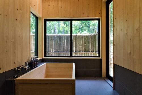 Hinoki no ie - Cottage with natural hot spring in a cypress bathtub image