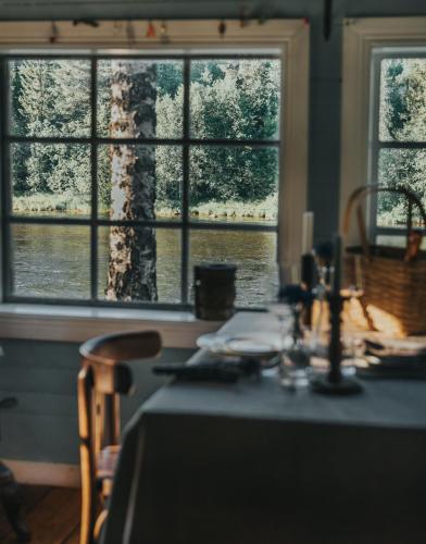 Cabin by Byske river surrounded by the forest