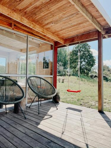 Luxurious red cottage with wood stove near lake