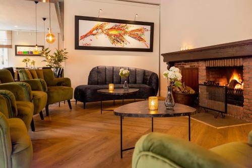 ห้องส่วนกลางสำหรับนั่งเล่น/ดูทีวี, Hotel Van der Maas in ออทมาร์ซุม แกร์น