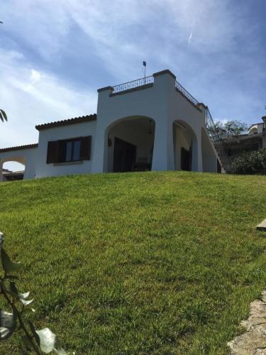 Ferienwohnung in Budoni mit Grill, gemeinschaftlichem Pool und Terrasse und Meerblick