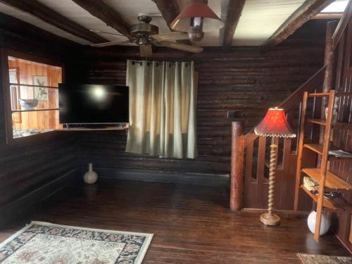 Restored historic log cabin & deck on Lake Erie in Luna Pier, USA