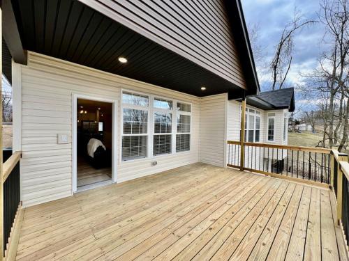 Beautiful NEW Ranch Home with a large deck and games