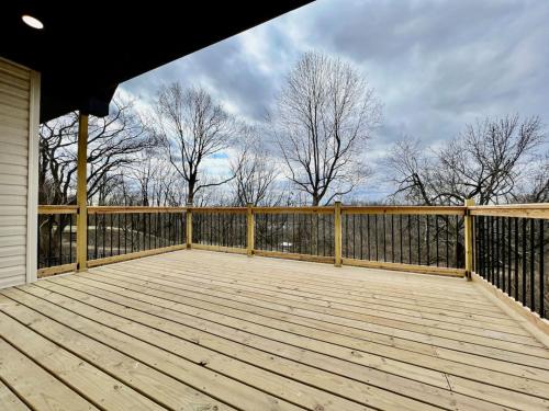 Beautiful NEW Ranch Home with a large deck and games