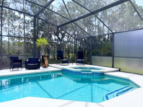 Great Privacy By Pool- Pool Home with Game Room home in Davenport, USA